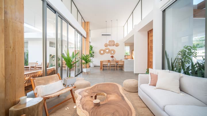 Open living room with live-edge coffee table and double-height ceilings