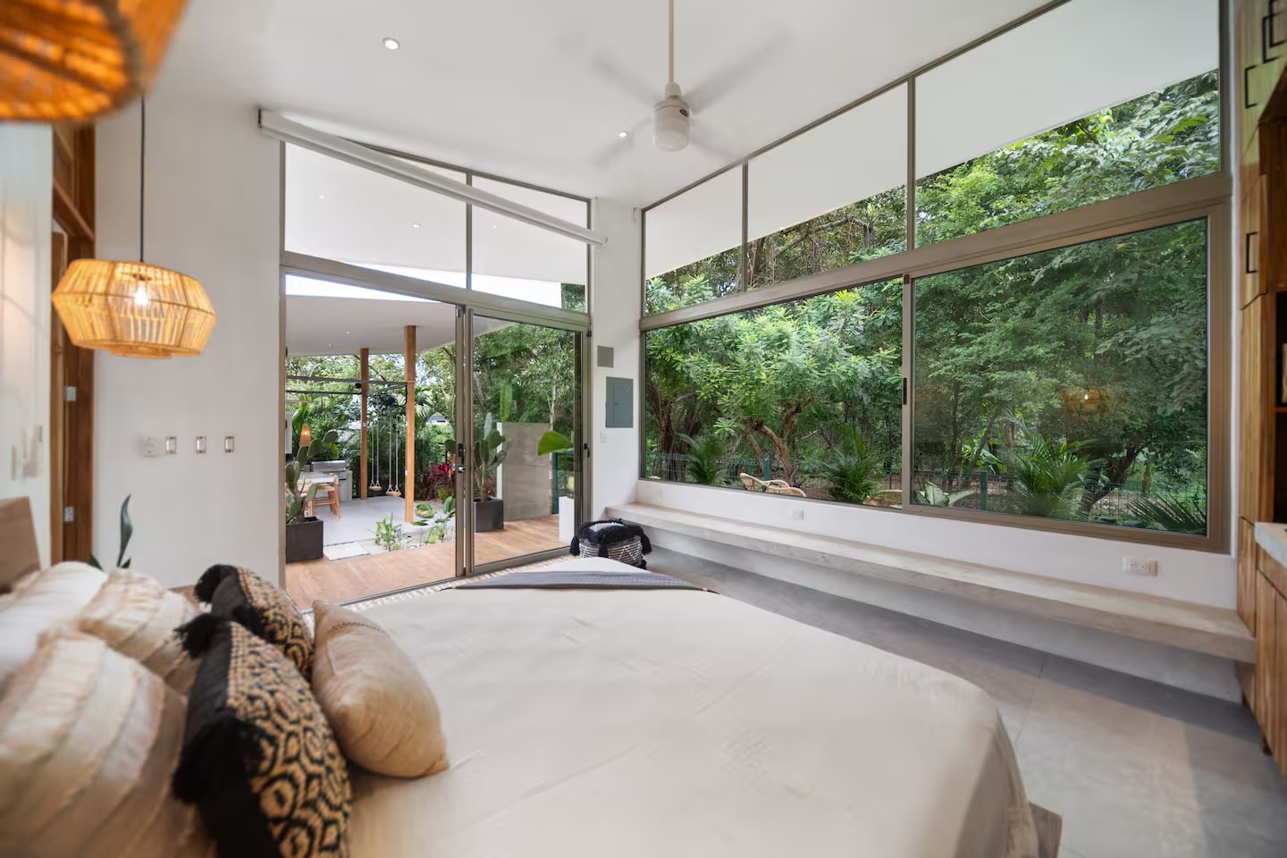 Bedroom suite with floor-to-ceiling jungle views